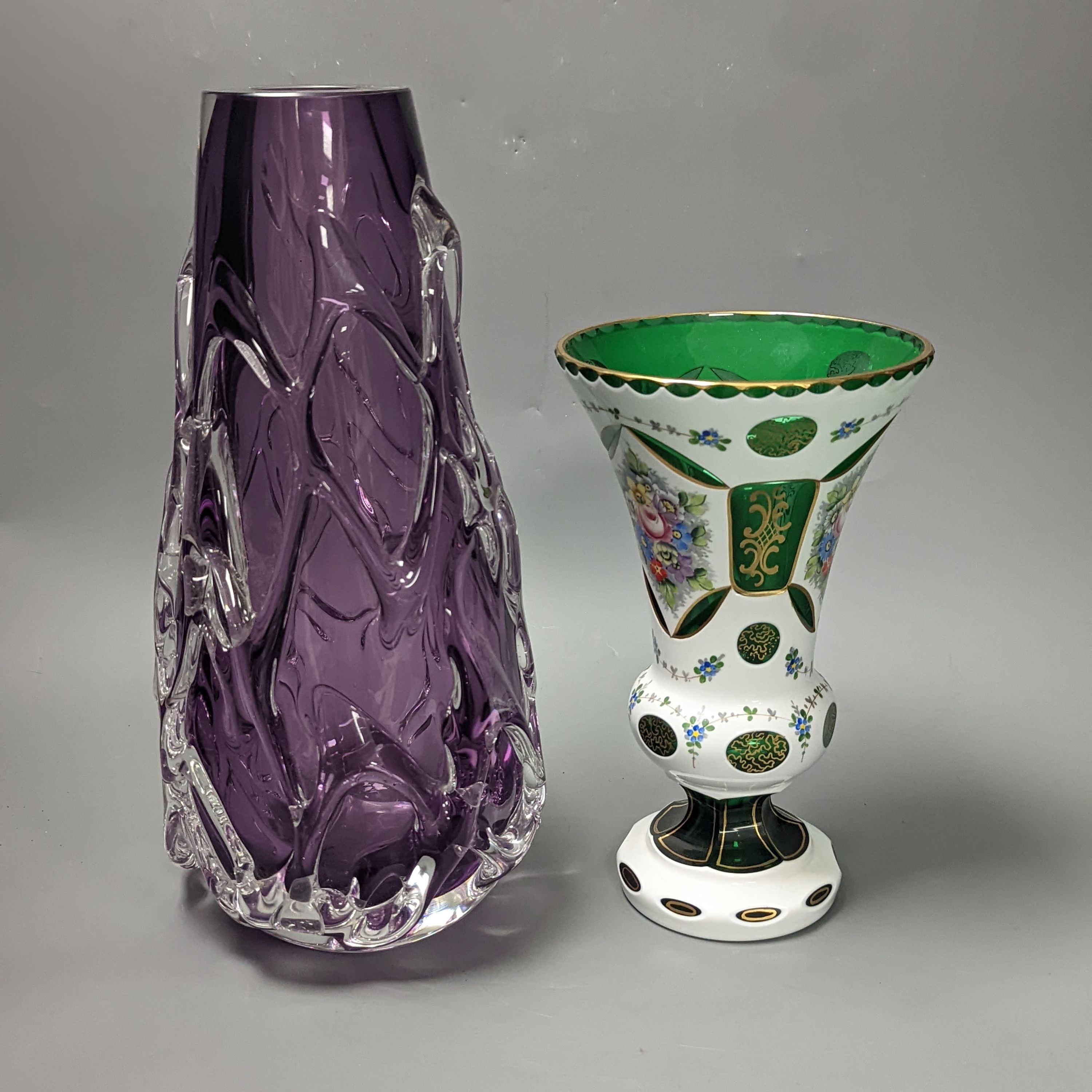 An amethyst art glass vase and Bohemian overlaid green glass vase 34cm